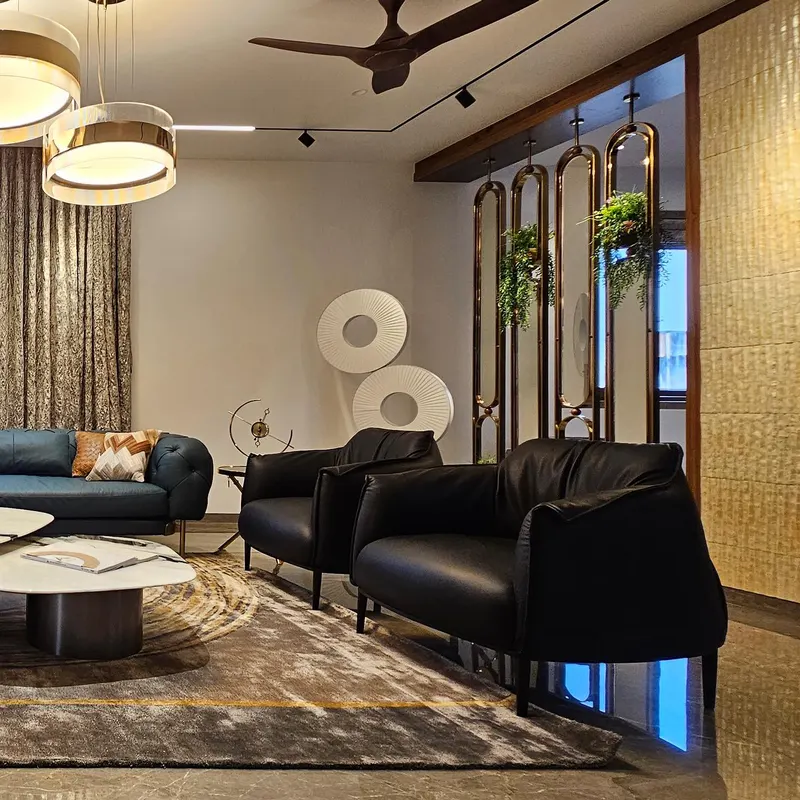 Black leather lounge chairs and a marble coffee table